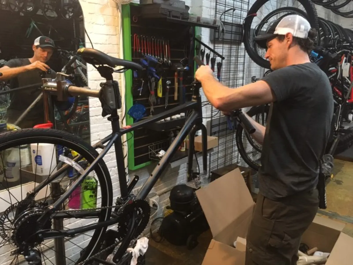 a person standing next to a bicycle