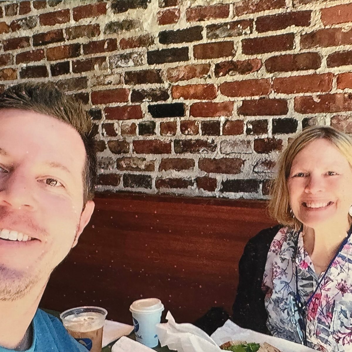 a man and a woman smiling for the camera